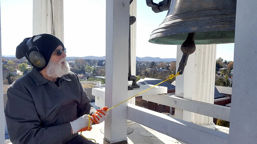  Ed Tinsley skillfully rang the museum’s bell by hand on several occasions. This photo was taken on November 11, 2018, on the centennial anniversary of the end of World War I. 
