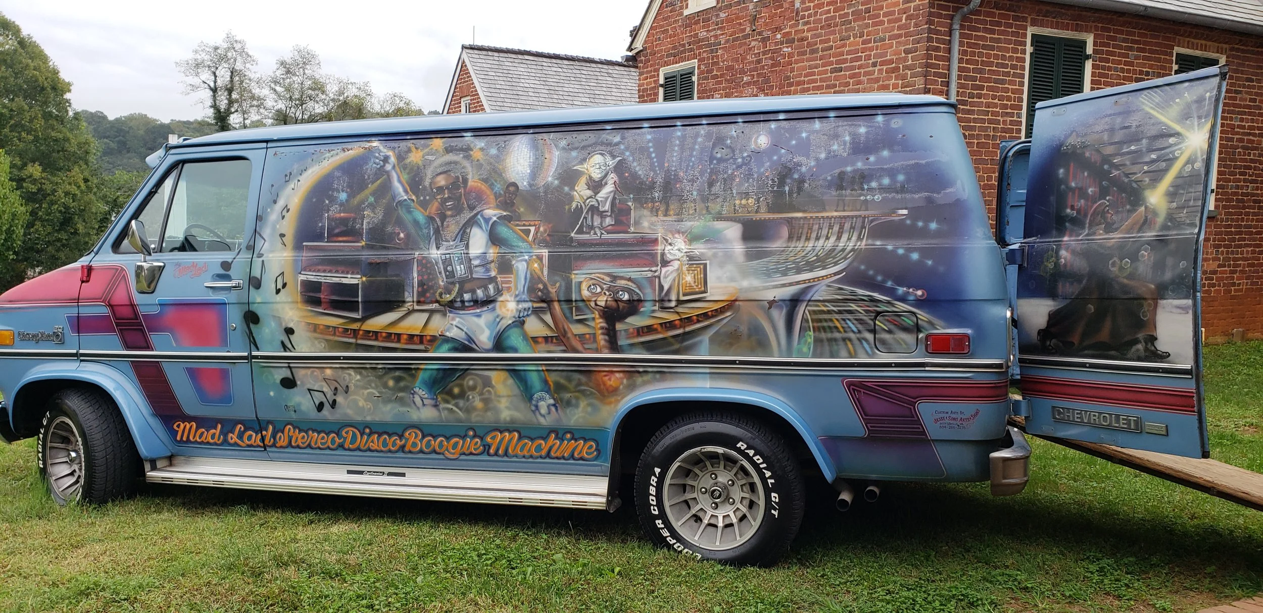  A recognizable van with an image of Goins painted on the side. 